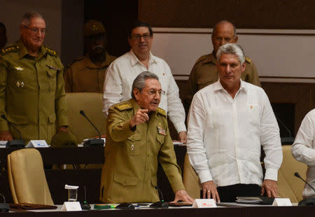 Cuba's President Raul Castro (L, front) gestures while standing next to First Vice-President Miguel Diaz-Canel (R) during an extraordinary session of the National Assembly, in Havana, Cuba June 1, 2017. ACN/Marcelino Vazquez/Handout via REUTERS