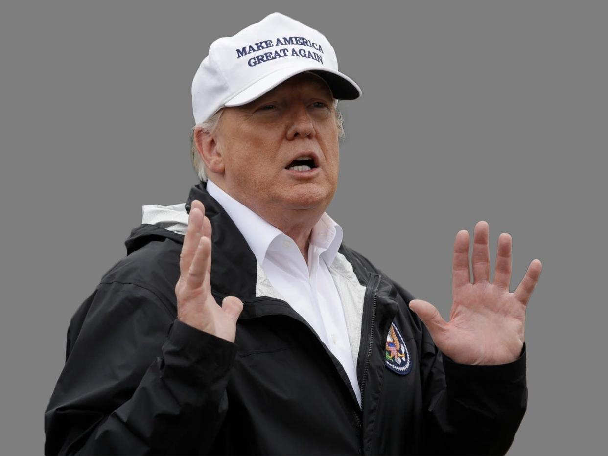 Donald Trump, as US President, speaks as he tours the U.S. border with Mexico at the Rio Grande, graphic element on gray