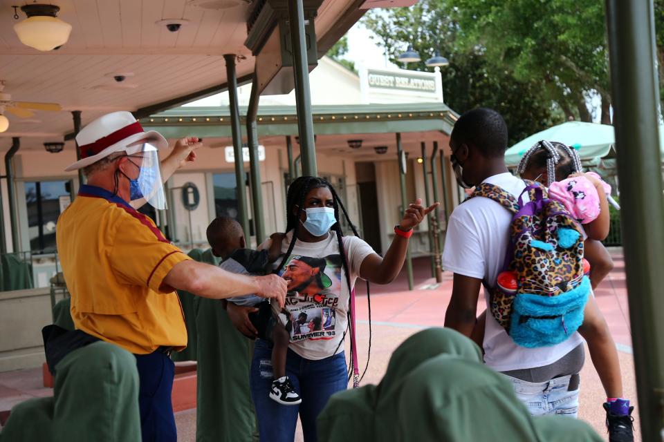 People and kids enter Magic Kingdom on Aug. 28, 2020.