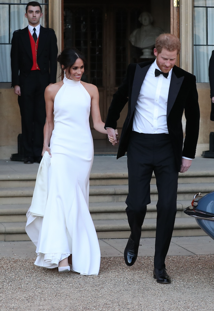 <p>But her tell-all wedding looks did not stop at the dress. For her eveing reception, Meghan stepped out in a halterneck, floor-length white gown by British designer Stella McCartney.<br><br>The choice to wear the famously sustainable fashion brand said everything about Meghan’s sentiments. <br>[Photo: Getty] </p>