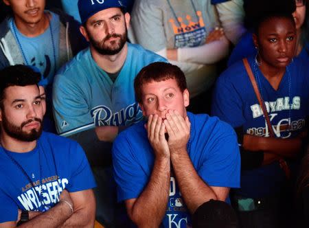 Kansas City Royals fans react as they watch the broadcast of baseball's World Series Game 7 between the San Francisco Giants and the Kansas City Royals, at The Kansas City Power & Light District in Kansas City, Missouri, October 29, 2014. REUTERS/Sait Serkan Gurbuz