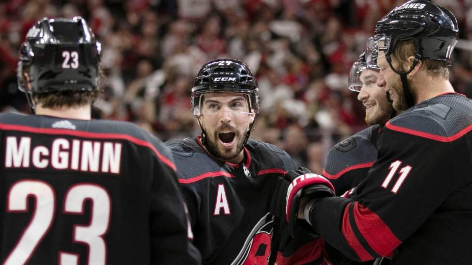 Carolina Hurricanes’ Justin Faulk (27) joins the celebration after a goal by Justin Williams in the third period during Game 6 of their first round Stanley Cup series against the Washington Capitals on Monday, April 22, 2019 at PNC Arena in Raleigh, N.C. The Hurricanes scored three goals in the third period rolling to a 5-2 victory.