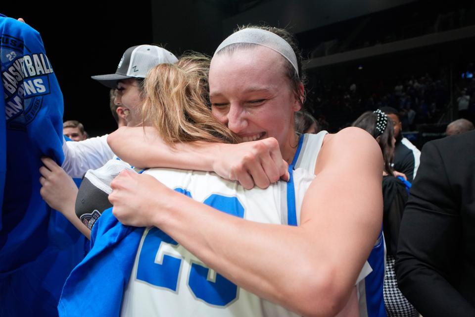 MTSU's Jalynn Gregory (right) hugs teammate Alexis Whittington (23) following winning the Conference USA tournament championship Saturday, 82-70 over Western Kentucky at Ford Center at the Star in Frisco, Texas.