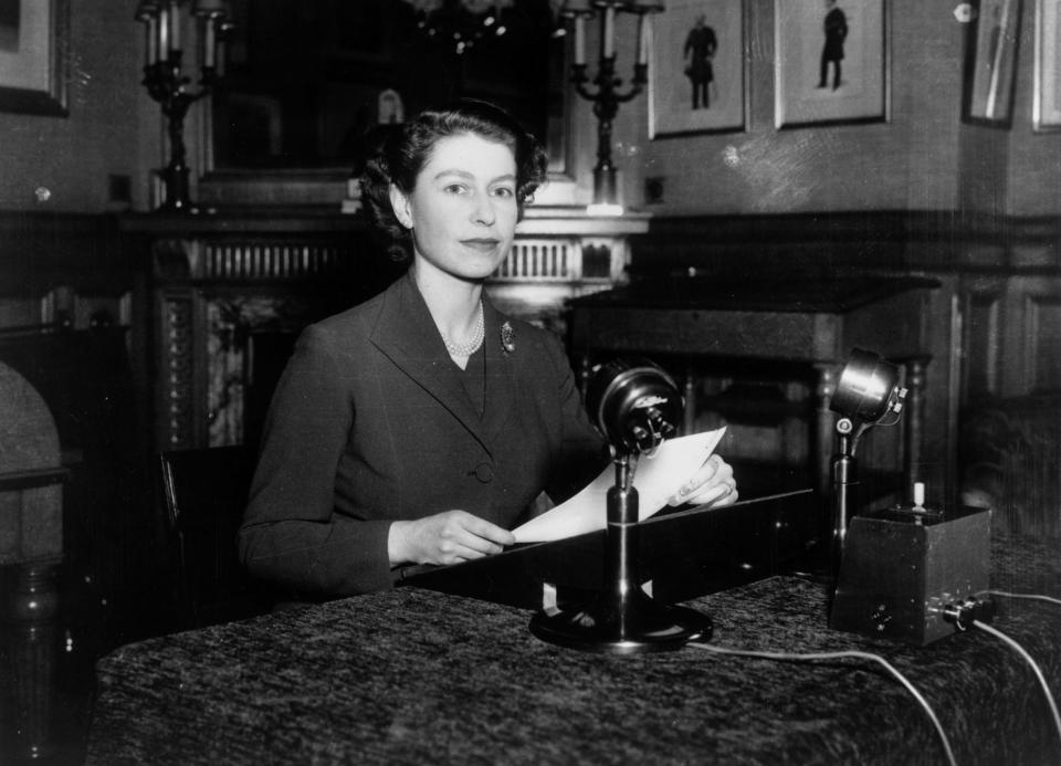 Queen Elizabeth II making her first-ever Christmas broadcast to the nation from Sandringham House in Norfolk on December 25, 1952.