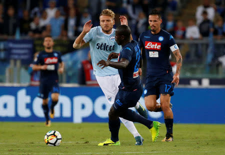 Soccer Football - Serie A - Lazio vs Napoli - Stadio Olimpico, Rome, Italy - September 20, 2017 Lazio’s Ciro Immobile in action with Napoli's Kalidou Koulibaly REUTERS/Ciro De Luca