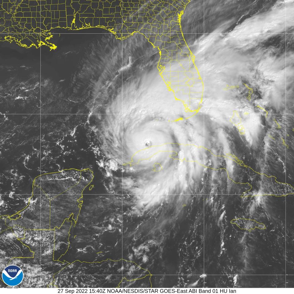 The eye of Hurricane Ian lies north of the west end of Cuba in this satellite image captured Tuesday, Sept. 27, 2022.