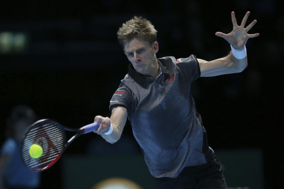 Kevin Anderson of South Africa plays a return to Novak Djokovic of Serbia in their ATP World Tour Finals singles tennis match at the O2 Arena in London, Saturday Nov. 17, 2018. (AP Photo/Tim Ireland)