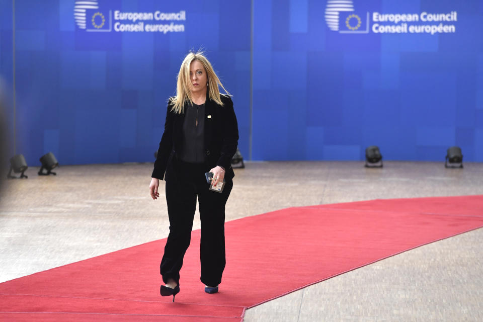 Italy's Prime Minister Giorgia Meloni arrives for an EU summit at the European Council building in Brussels, Thursday, March 23, 2023. European Union leaders meet Thursday for a two-day summit to discuss the latest developments in Ukraine, the economy, energy and other topics including migration. (AP Photo/Geert Vanden Wijngaert)