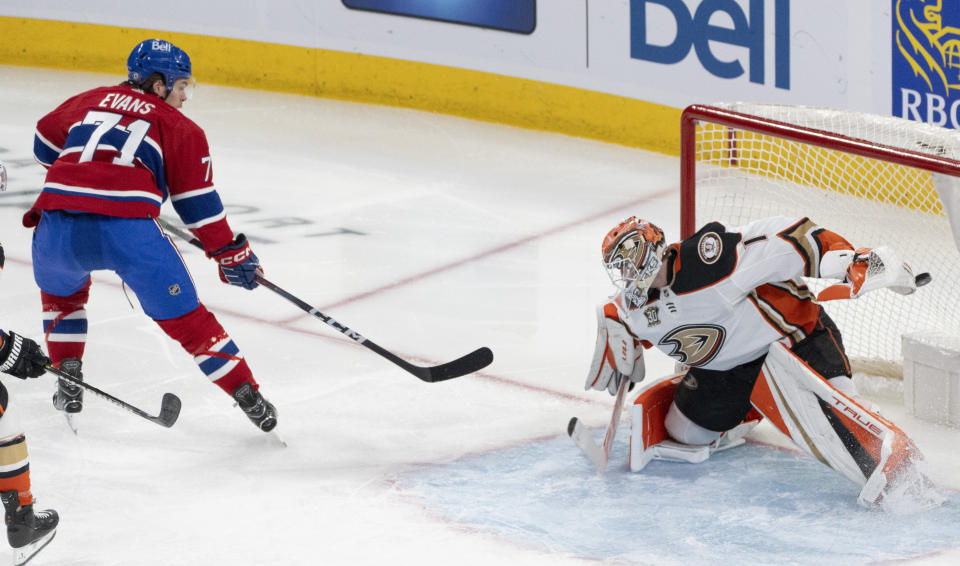 Montreal Canadiens' Jake Evans (71) scores on Anaheim Ducks goaltender Lukas Dostal (1) during the second period of an NHL hockey game Tuesday, Feb. 13, 2024, in Montreal. (Christinne Muschi/The Canadian Press via AP)