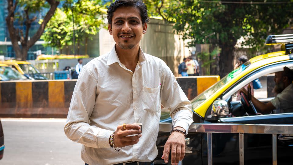 Salesperson Parag Sawla drinks chai during a break in Mumbai, India, on April 16, 2024. - Noemi Cassanelli/CNN