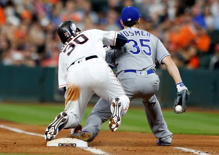 Apr 14, 2016; Houston, TX, USA; Houston Astros center fielder Carlos Gomez (30) does not tag up on time and is forced out by Kansas City Royals first baseman Eric Hosmer (35) in the six inning at Minute Maid Park. Thomas B. Shea-USA TODAY Sports