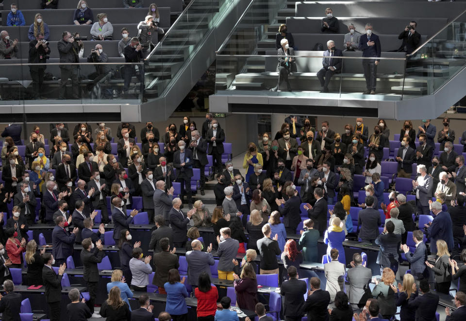 The ambassador of the Ukraine Andrij Melnyk, stands on a visitors tribune, as lawmaker pay their tribute at the beginning of a meeting of the German federal parliament, Bundestag, at the Reichstag building in Berlin, Germany, Sunday, Feb. 27, 2022. (AP Photo/Michael Sohn)