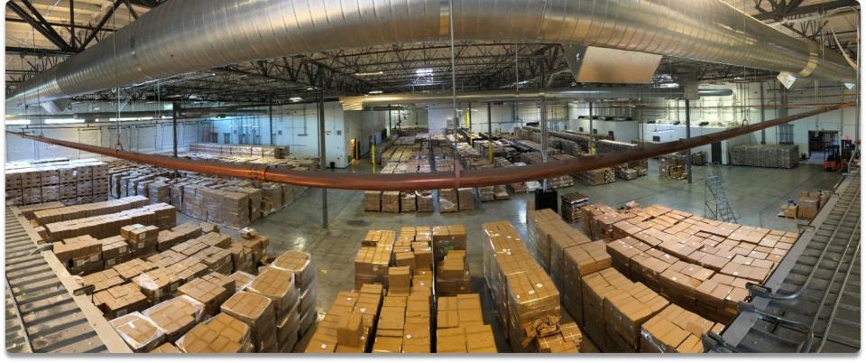 Boxes of personal protective equipment sit in a warehouse. Photo from mid-2020.