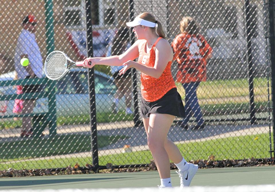 Katherine Steele hits a return shot in her match in third singles action on Monday.