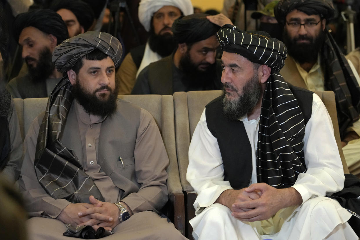 CORRECTS THAT BASHIR NOORZAI WAS RELEASED FROM AN AMERICAN PRISON NOT GUANTANAMO BAY - Bashir Noorzai, right, a senior Taliban detainee held in an American prison, talks to Acting Minister of Defense Mullah Mohammad Yaqoob, during a release ceremony, at the Intercontinental Hotel, in Kabul, Afghanistan, Monday, Sept. 19, 2022. Noorzai, a notorious drug lord and member of the Taliban, told reporters in Kabul on Monday that he spent 17 years and six months in a U.S. prison. Taliban-appointed Foreign Minister Amir Khan Muttaqi said Monday that a released American, in what appears to have been part of a swap, was Mark Frerichs, a Navy veteran and civilian contractor kidnapped in Afghanistan in 2020. (AP Photo/Ebrahim Noroozi)