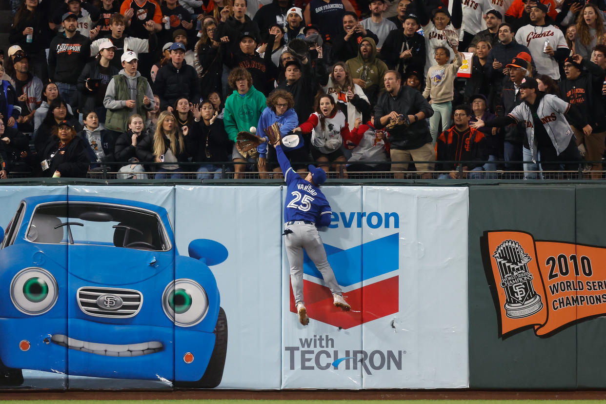 Daulton Varsho just misses what would have been an incredible home run robbery. (Lachlan Cunningham/Getty Images)