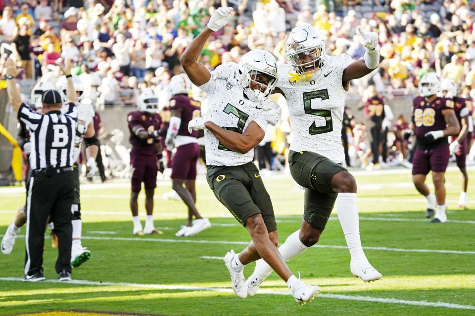 Oregon Ducks wide receiver Gary Bryant Jr. (2) celebrates his touchdown with wide receiver Traeshon Holden (5) against the Arizona State Sun Devils in the first half at Mountain America Stadium on Nov. 18 in Tempe, Arizona.