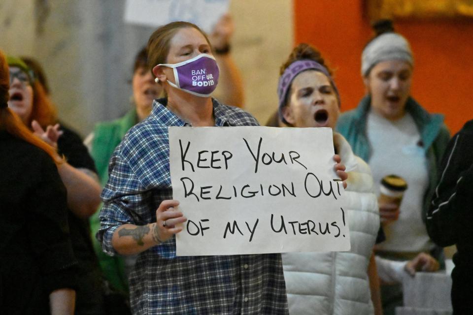 Protester outside the Kentucky Supreme Court chambers rally in favor of abortion rights as the Kentucky Supreme Court hears arguments whether to temporarily pause the state's abortion ban in Frankfort, Ky., Tuesday, Nov. 15, 2022. (AP Photo/Timothy D. Easley)