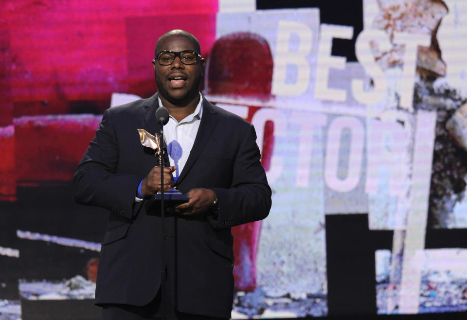 Steve McQueen accepts the award for best director for "12 Years a Slave" on stage at the 2014 Film Independent Spirit Awards, on Saturday, March 1, 2014, in Santa Monica, Calif. (Photo by Chris Pizzello/Invision/AP)