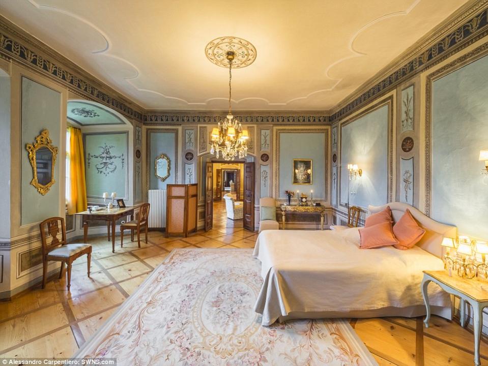 <p>This ornate bedroom is one of the castle’s 80 rooms and 15 bedrooms. (Concierge Auctions) </p>