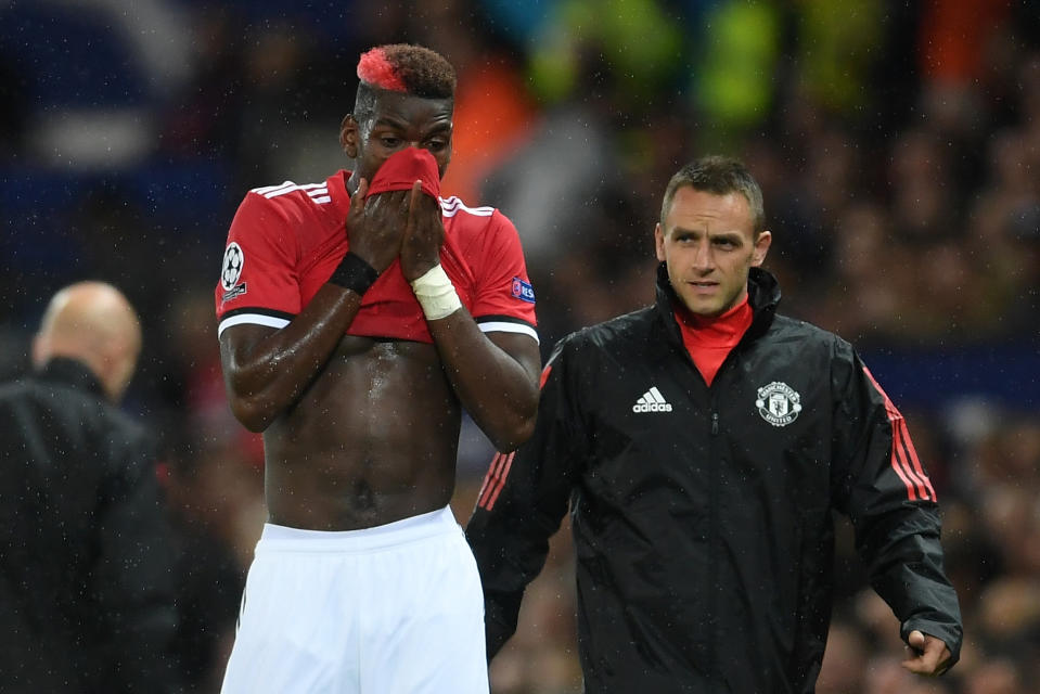 Paul Pogba leaves the field injured at Old Trafford.