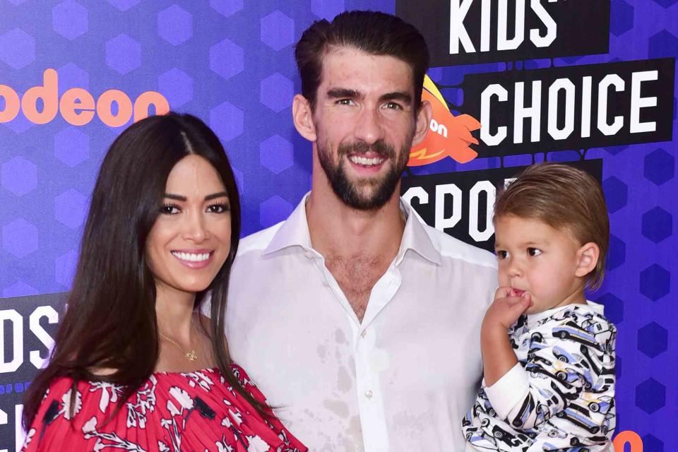 <p>Rodin Eckenroth/FilmMagic</p> From left: Nicole Phelps, Michael Phelps and son Boomer in 2018