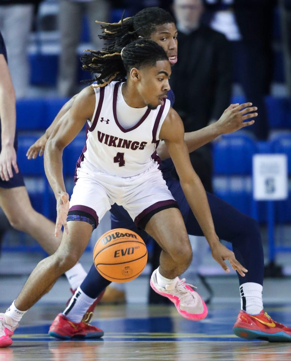 St. Elizabeth's Steven Nixon works on offense in front of Salesianum's Isaiah Hynson in the first half of the Sals' 65-51 win in a DIAA state tournament semifinal at the Bob Carpenter Center, Thursday, March 7, 2024.