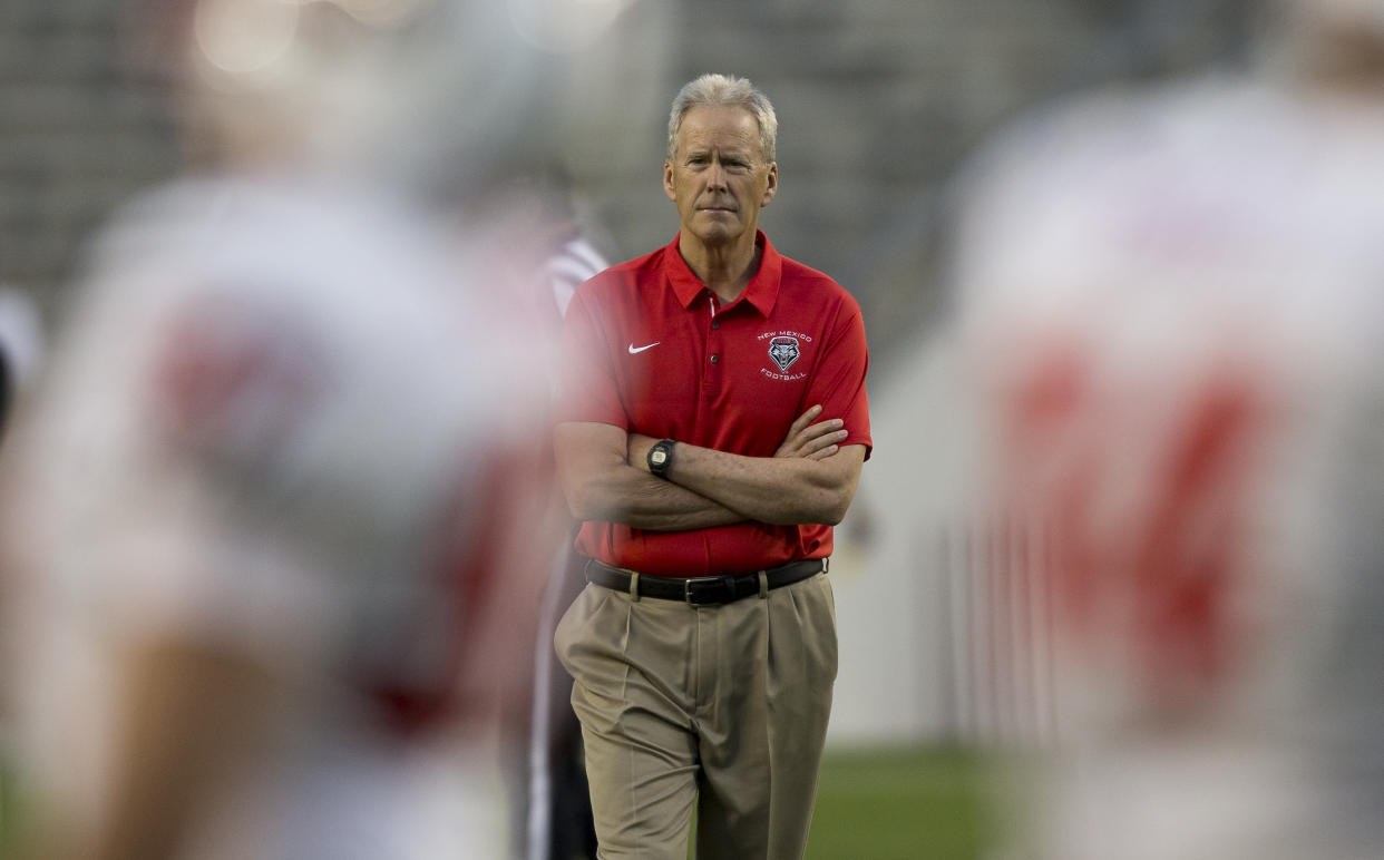 New Mexico head coach Bob Davie watches him team warm up before the start of an NCAA college football game against Texas A&M on Saturday, Nov. 11, 2017, in College Station, Texas. (AP Photo/Sam Craft)