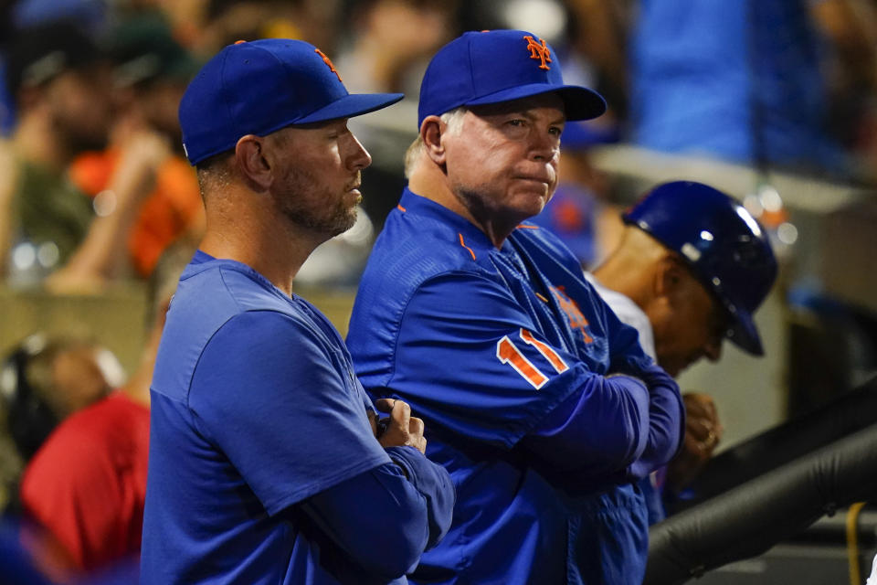 New York Mets manager Buck Showalter, center, reacts while watching his team play during the seventh inning of a baseball game against the San Diego Padres, Saturday, July 23, 2022, in New York. (AP Photo/Frank Franklin II)