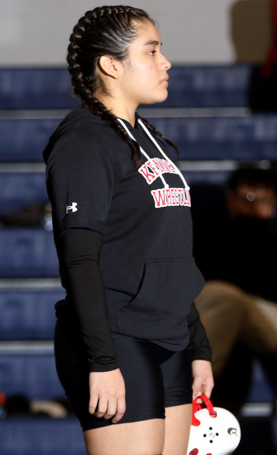 Stefany Morales, a student at International High School and a wrestler on the John F. Kennedy High School Wrestling Team, waits for her turn on the mat.  Wednesday, January 19, 2022