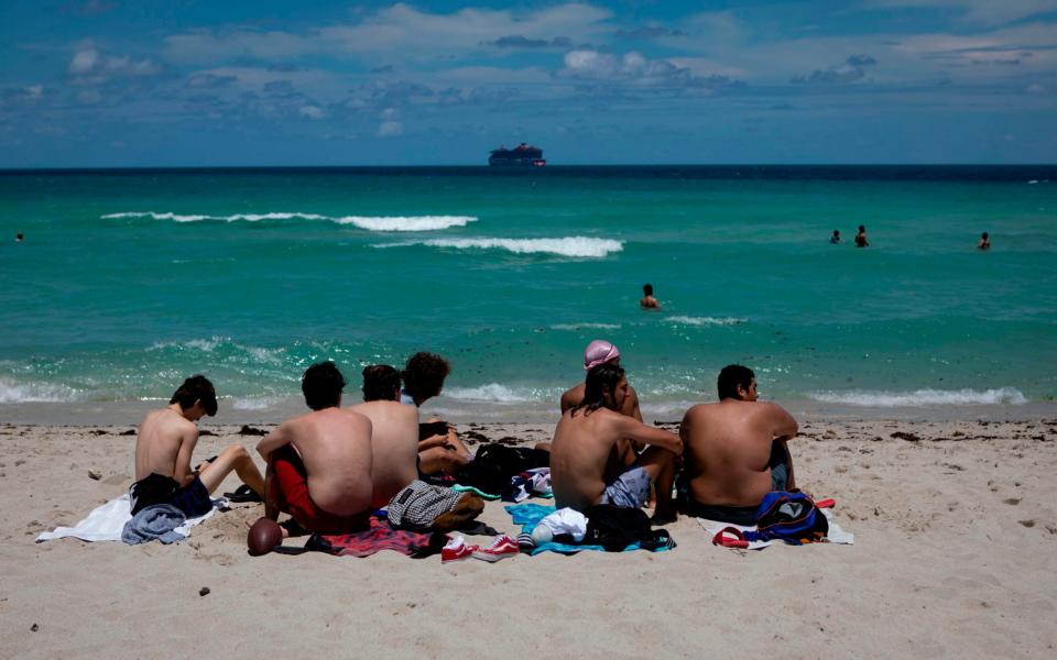 Beachgoers sunbathe in Miami Beach, Florida on June 16, 2020 - AFP