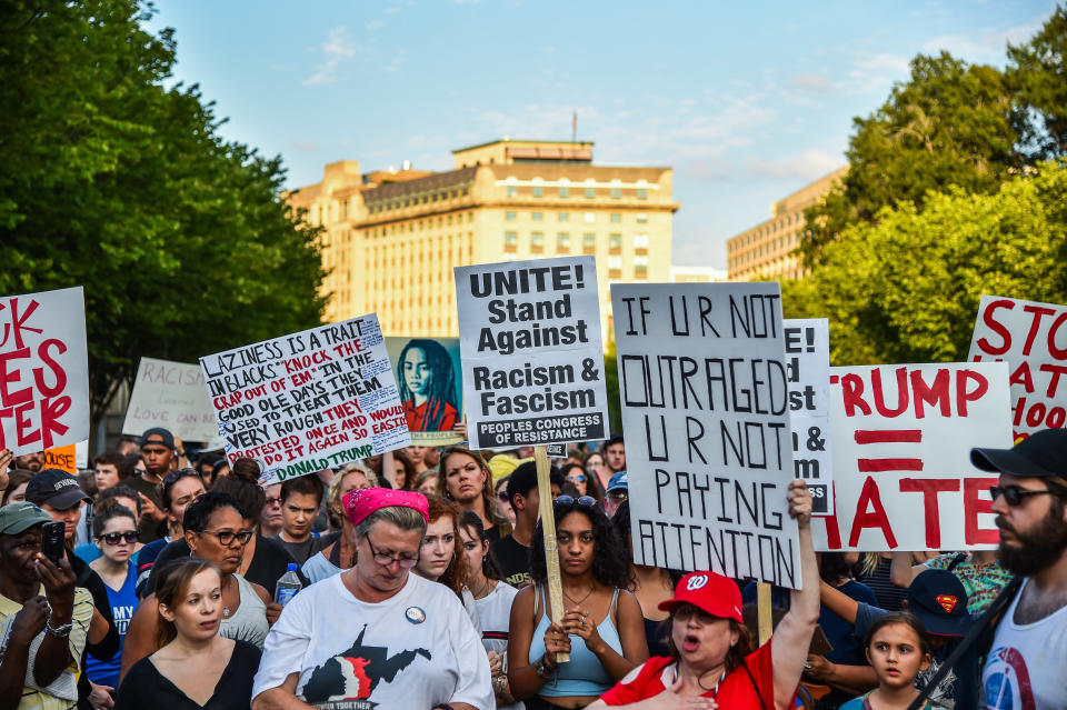 People gather in front of the White House to hold a vigil on Aug. 13, one day after the violence in Charlottesville.