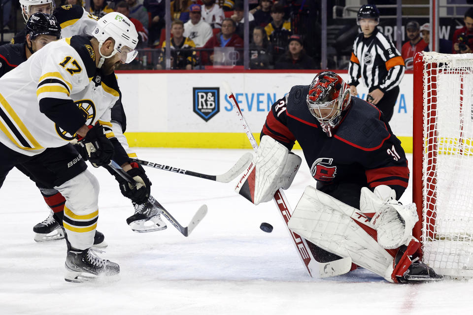 Boston Bruins' Nick Foligno (17) has his shot blocked by Carolina Hurricanes goaltender Frederik Andersen (31) during the first period of an NHL hockey game in Raleigh, N.C., Sunday, Jan. 29, 2023. (AP Photo/Karl B DeBlaker)