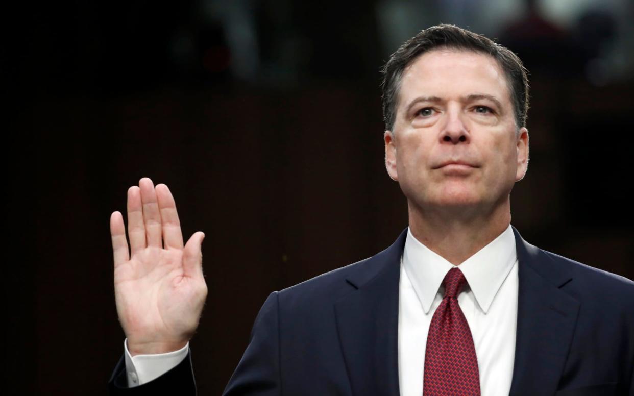 Former FBI Director James Comey is sworn in during a Senate Intelligence Committee hearing  - AP