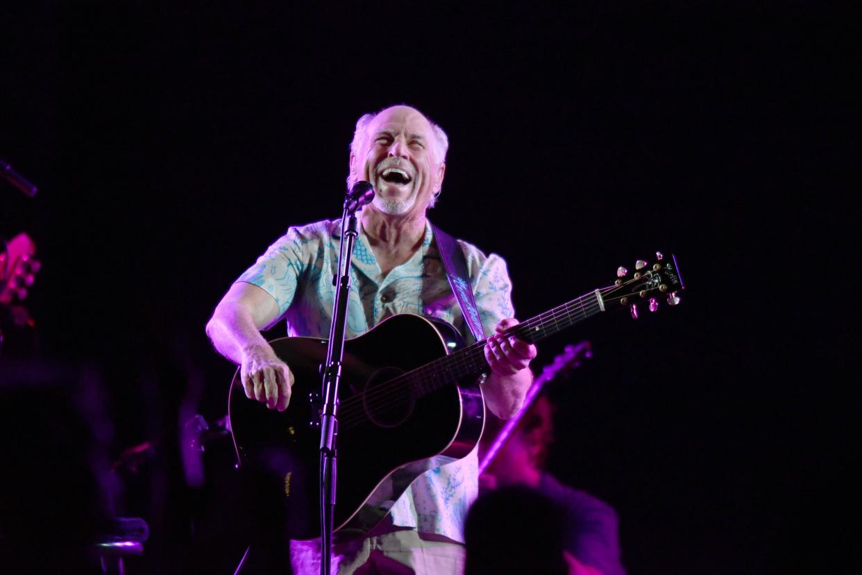 Jimmy Buffett shown performing at Old School Square in 2021,