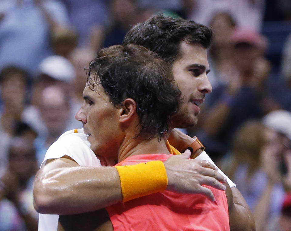 Rafael Nadal, of Spain, hugs Karen Khachanov, of Russia, after Nadal defeated Khachanov during the third round of the U.S. Open tennis tournament, Friday, Aug. 31, 2018, in New York. (AP Photo/Jason DeCrow)