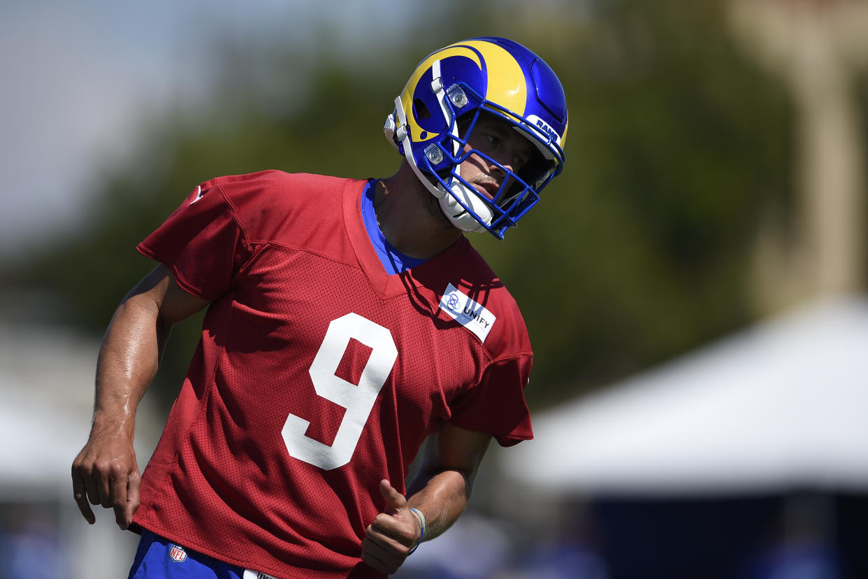 Los Angeles Rams quarterback Matthew Stafford runs on the field during an NFL football training camp practice in Irvine, Calif., Saturday, July 31, 2021. (AP Photo/Kelvin Kuo)