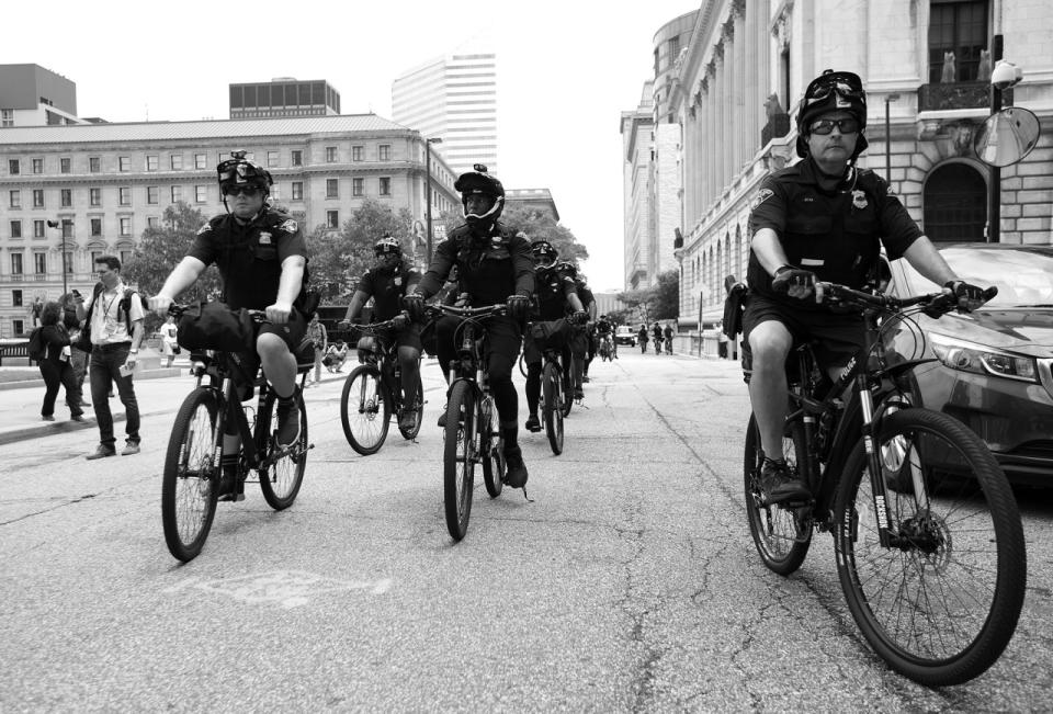 <p>Bicycle officers ride alongside anti-Trump demonstrators in Cleveland. (Photo: Khue Bui for Yahoo News)</p>