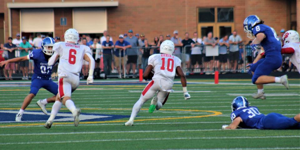 Beechwood senior Antonio Robinson (10) breaks into the open field during a 95-yard kickoff return for a touchdown as Covington Catholic defeated Beechwood 31-14 Sept. 16, 2022.