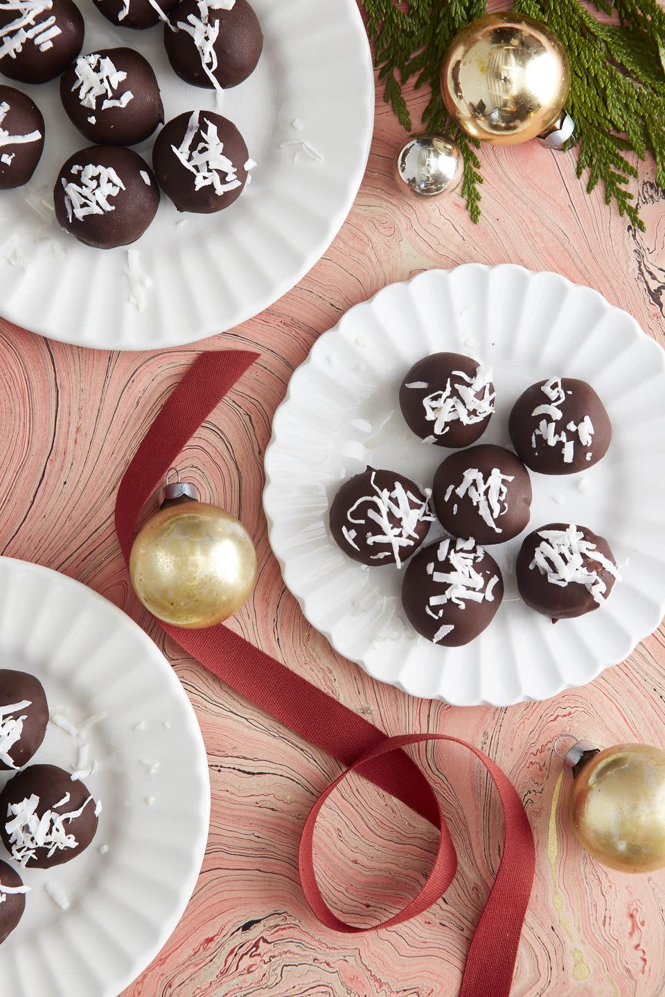 <p>It just isn't Christmas without sweet treats. Swapping regular butter for margarine or a vegan alternative makes these perfectly animal-free.</p><p><strong><a href="https://www.countryliving.com/food-drinks/a34373834/chocolate-coconut-truffles-recipe/" rel="nofollow noopener" target="_blank" data-ylk="slk:Get the recipe;elm:context_link;itc:0;sec:content-canvas" class="link ">Get the recipe</a>.</strong></p><p><strong><a class="link " href="https://www.amazon.com/Earth-Balance-Lactose-Non-Dairy-Non-GMO/dp/B07QT8T4XY/?tag=syn-yahoo-20&ascsubtag=%5Bartid%7C10050.g.34473510%5Bsrc%7Cyahoo-us" rel="nofollow noopener" target="_blank" data-ylk="slk:SHOP VEGAN BUTTERS;elm:context_link;itc:0;sec:content-canvas">SHOP VEGAN BUTTERS</a></strong> </p>
