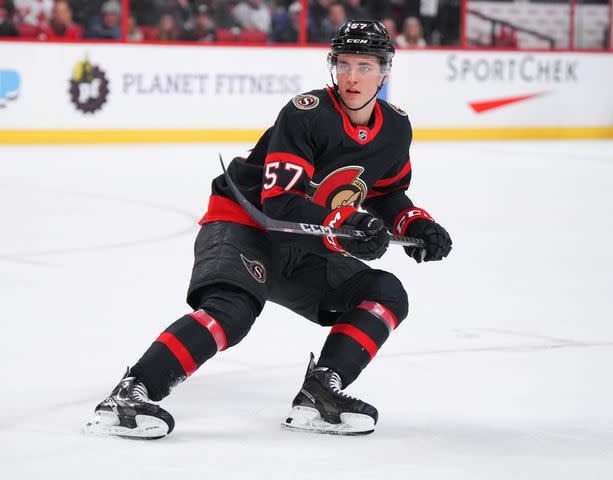 <p>Andre Ringuette/NHLI via Getty</p> Shane Pinto #57 of the Ottawa Senators skates against the Tampa Bay Lightning at Canadian Tire Centre on March 23, 2023 in Ottawa, Ontario, Canada.