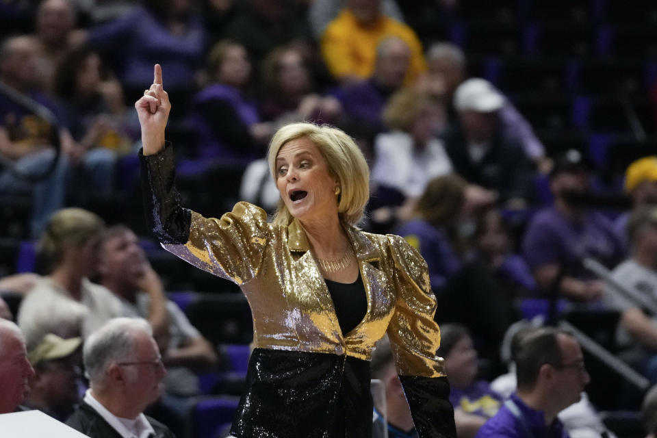 LSU head coach Kim Mulkey calls out from the bench in the first half an NCAA college basketball game against Arkansas in Baton Rouge, La., Thursday, Jan. 19, 2023. (AP Photo/Gerald Herbert)