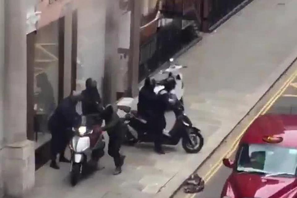 The moped gang leap onto their vehicles outside Boodles jewellers in Knightsbridge