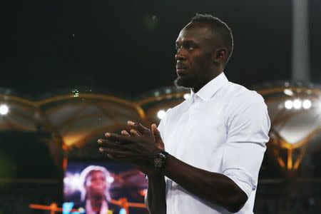 Athletics - Gold Coast 2018 Commonwealth Games - Women's 200m - Medal Ceremony - Carrara Stadium - Gold Coast, Australia - April 12, 2018. Former Jamaican sprinter Usain Bolt attends the ceremony. REUTERS/Jeremy Lee