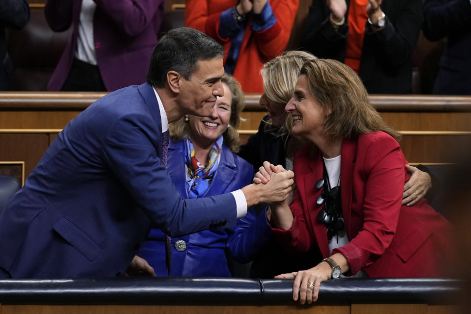 Spain's acting Prime Minister Pedro Sanchez celebrates with party members after he was chosen by a majority of legislators to form a new government after a parliamentary vote at the Spanish Parliament in Madrid, Spain, Thursday, Nov. 16, 2023. (AP Photo/Manu Fernandez)