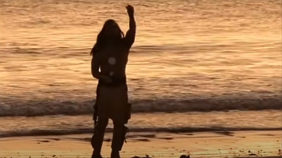 A man standing on the shore in We Shall Remain