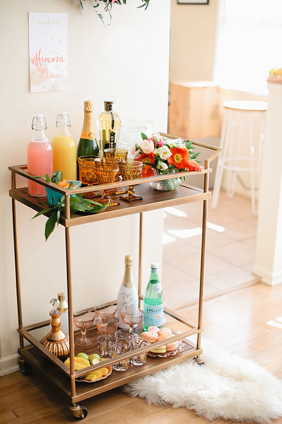 <p>Every perfectly curated mimosa bar needs stunning glassware guests can fill up. Champagne flutes or coupes are solid choices, but you can always go with anything from tumblers to the nice glass set in your cabinet you've been dying to break out.</p><p>See more at <a href="http://www.100layercake.com/blog/2015/04/01/easter-brunch-inspiration-spring-party-ideas/" rel="nofollow noopener" target="_blank" data-ylk="slk:100 Layers of Cake;elm:context_link;itc:0;sec:content-canvas" class="link ">100 Layers of Cake</a>.<br></p>