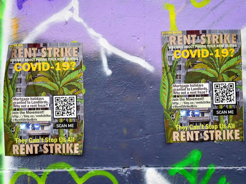 Posters referencing Covid-19 and a rent strike: Ben Birchall/PA Wire/PA Images