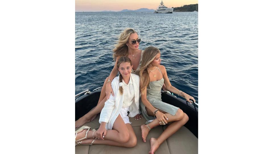 Amanda Holden posing on boat with daughters Lexi and Hollie 