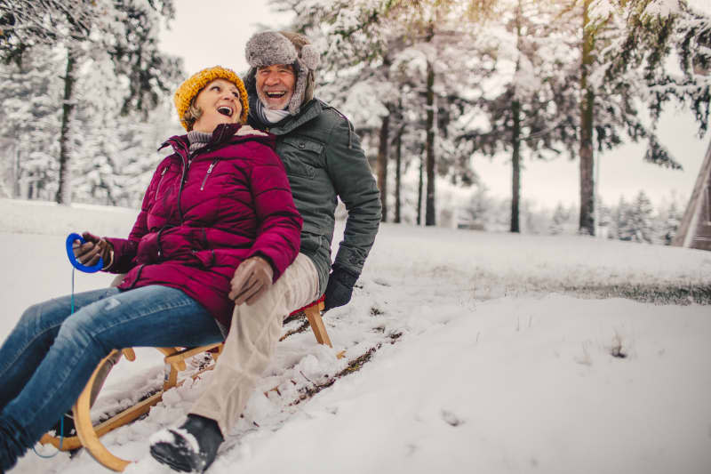 couple sledding.